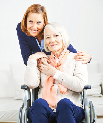 caregiver and elderly smiling