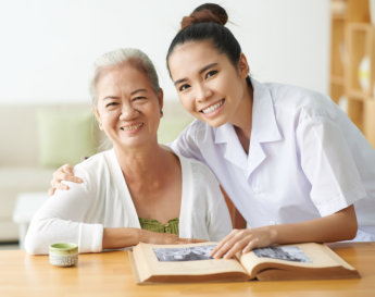 caregiver and elderly smiling